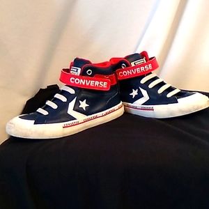 Boy's size 1 leather Converse hightops in navy and red. Great look for winter 👌